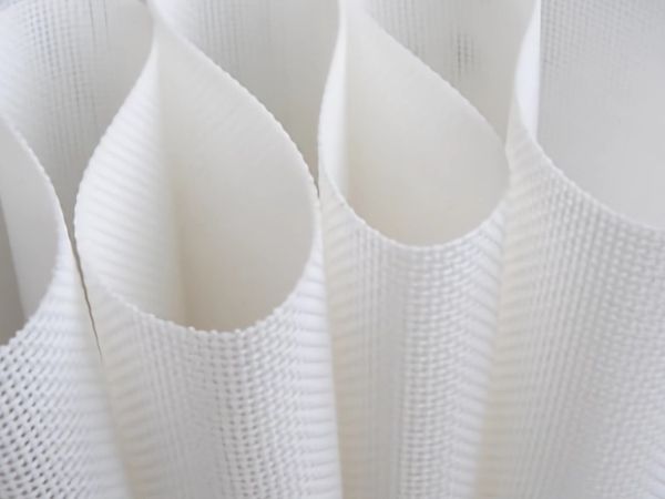 A roll of white polyester filter belt without special seam