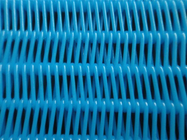 A blue polyester spiral press-filter fabric detail