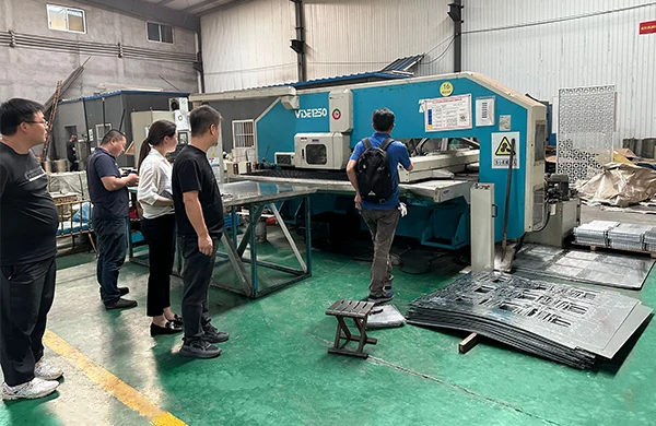 The staff are showing the customers around the factory