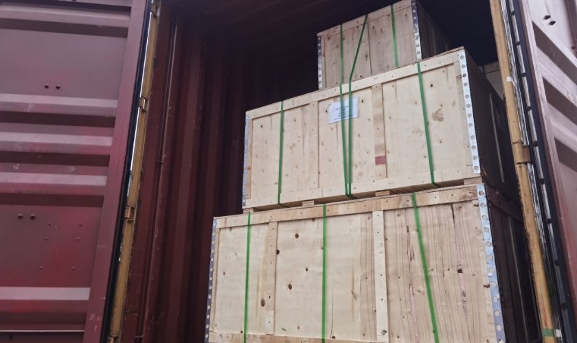 Several wooden cases in the container.