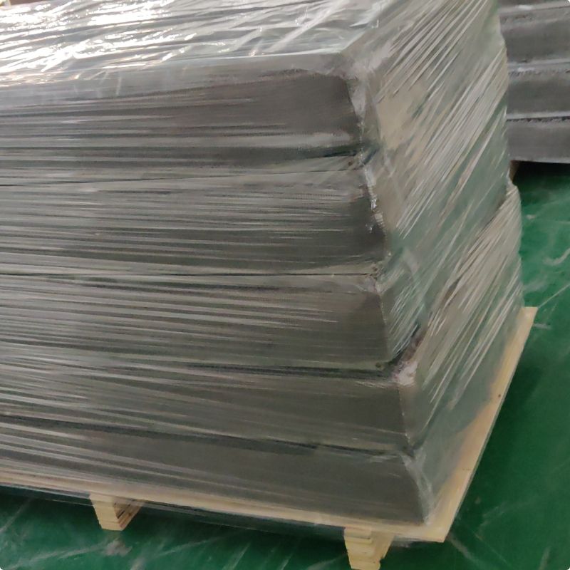 A bundle of rectangular demister pads are packed with plastic film and wooden pallet.