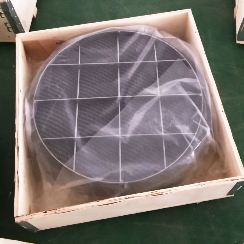 Two pieces of round demister pads are placed in the wooden case.