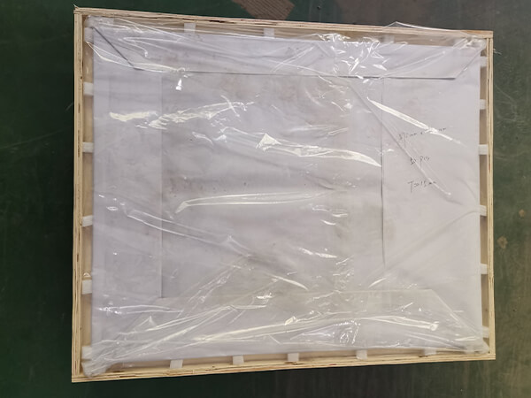 Etching sheets packed in a wooden crate