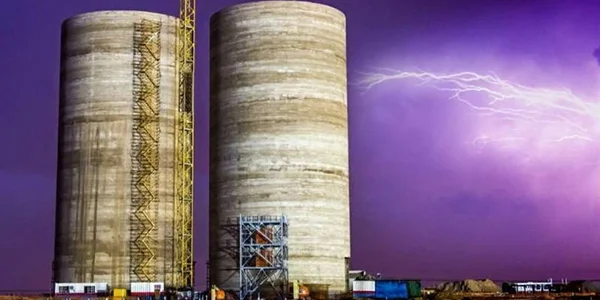 Composite construction utilizes an expanded metal mesh lightning protection system.