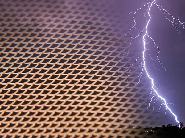 An expanded metal mesh made of purple copper.