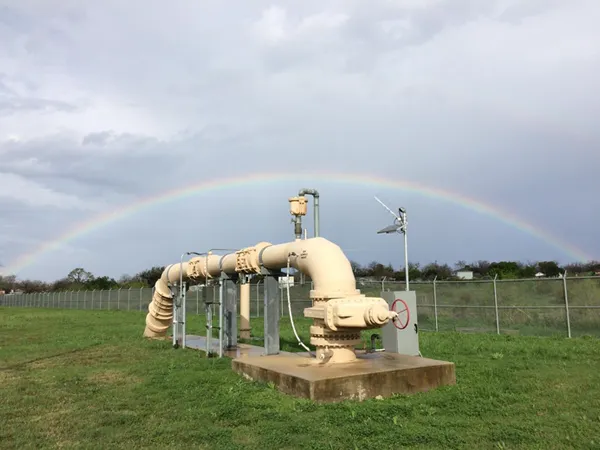 Water wells on a green lawn