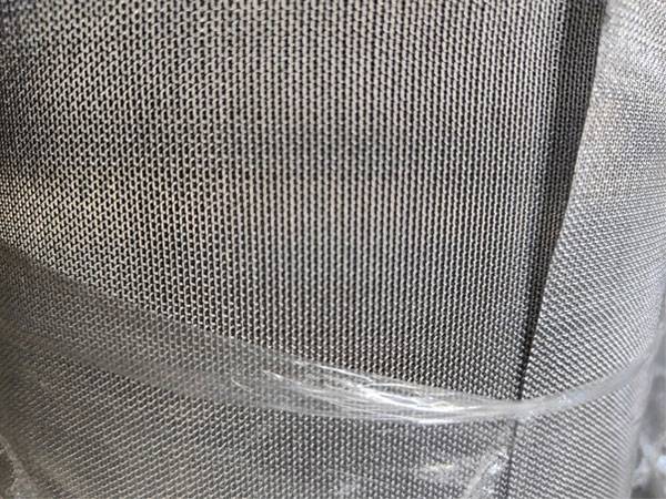A roll of foaming furnace mesh belt wrapped in plastic film