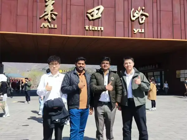 Group photo of managers and Indian partners at Mutianyu Great Wall entrance