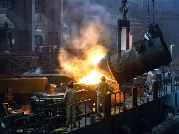 2 workers are conducting metallurgical operation.