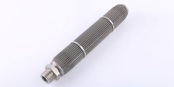 A pleated sintered felt candle filter