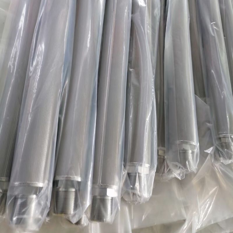Pleated sintered mesh candle filters in various lengths are placed with plastic film.