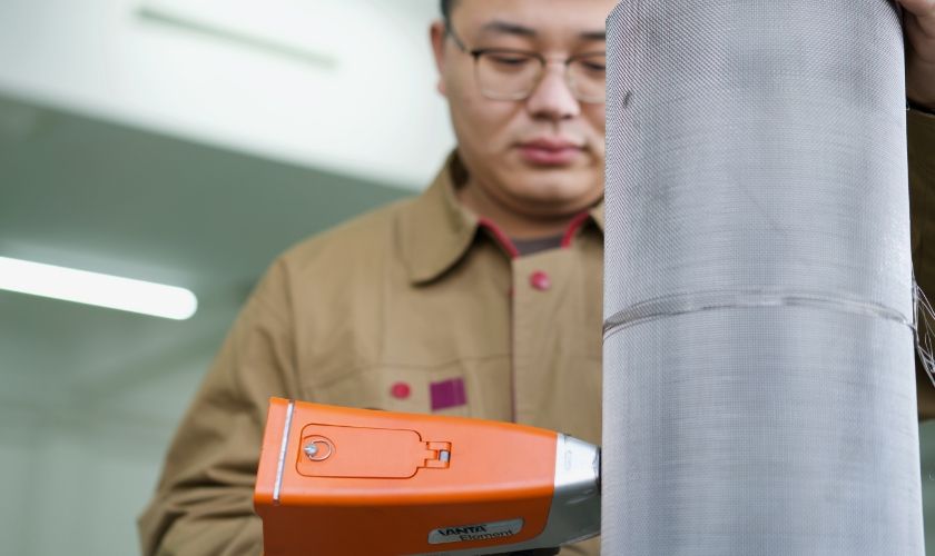 A worker is testing the chemical composition with XRF.