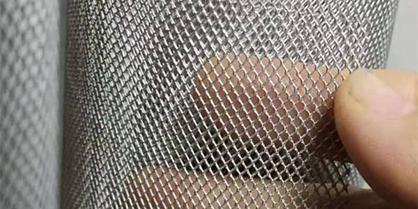 A man is showing us titanium expanded mesh details