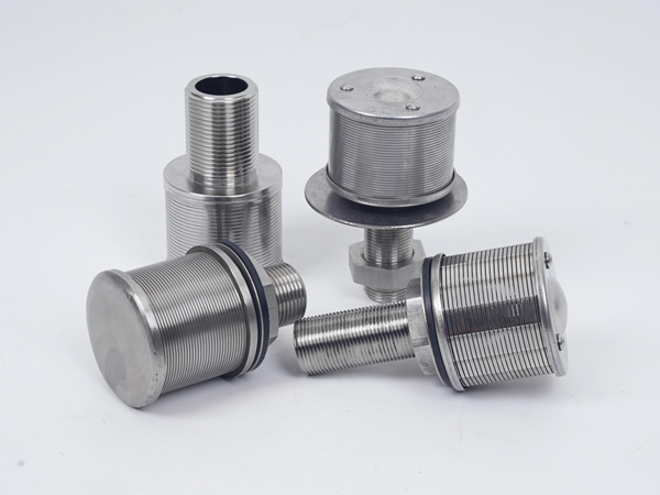 Four wedge wire nozzles on a white background