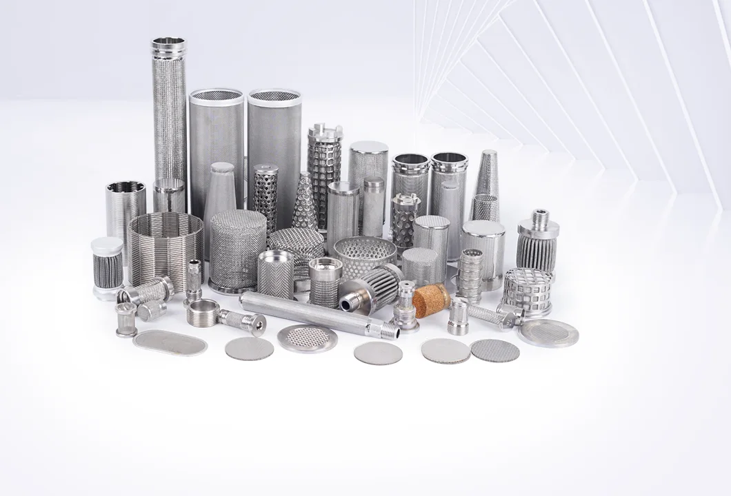 Assorted metallic wire mesh filter elements (cylindrical, conical, disc-shaped, etc.) in varied sizes, displayed together on a light background.